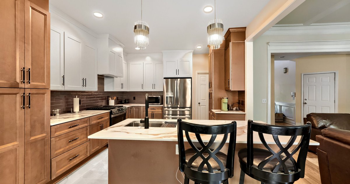 Kitchen remodel with two-tone cabinetry and large island in Atlanta, GA