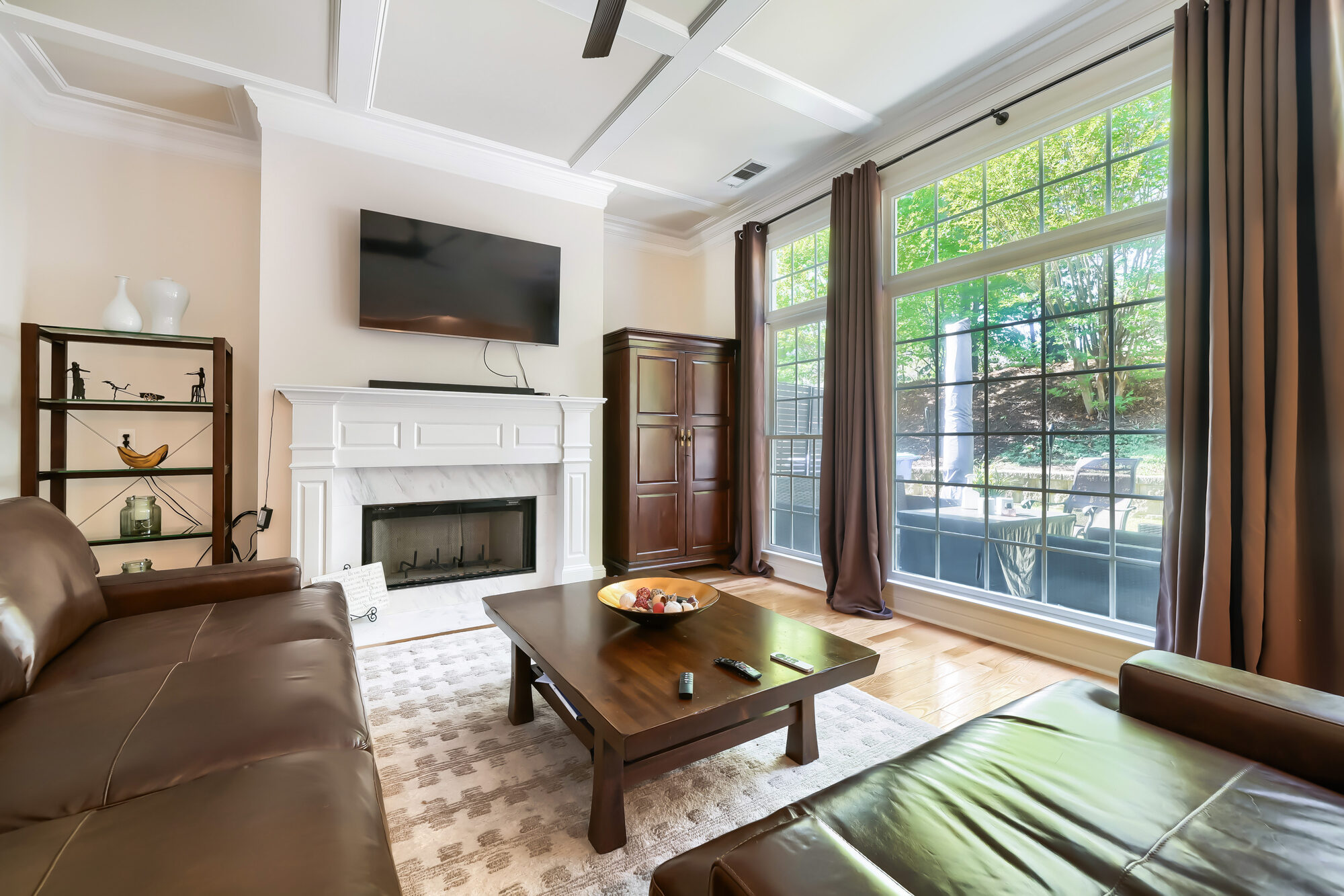 living-room-fireplace-tv-leather-sofas-tall-windows-atlanta-ga-optimized
