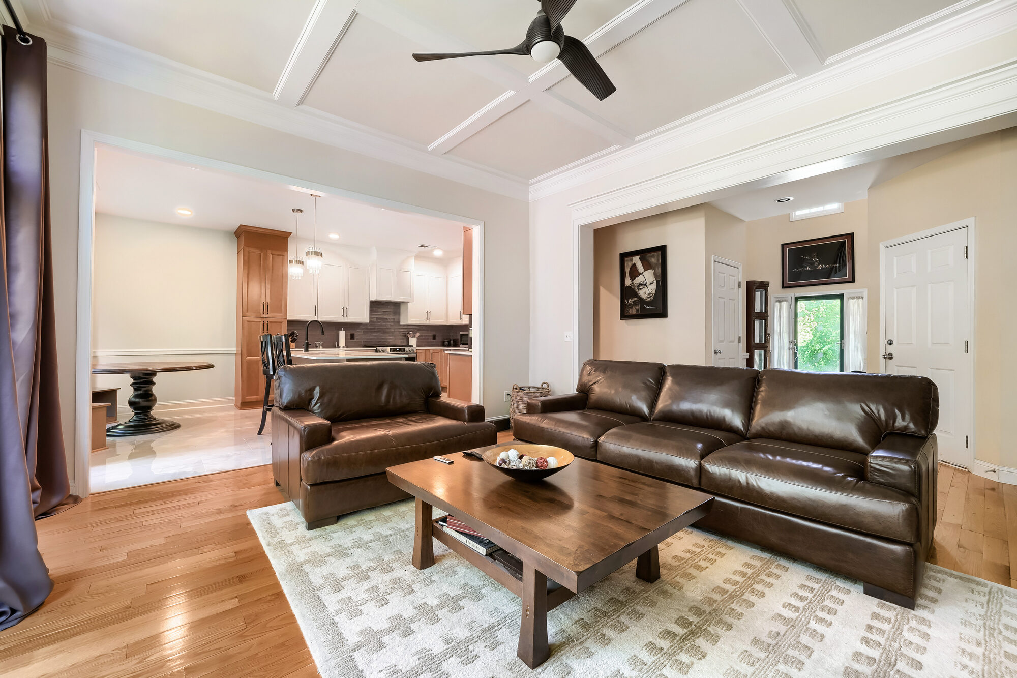 living-room-open-to-kitchen-leather-sofas-wood-coffee-table-atlanta-ga-optimized