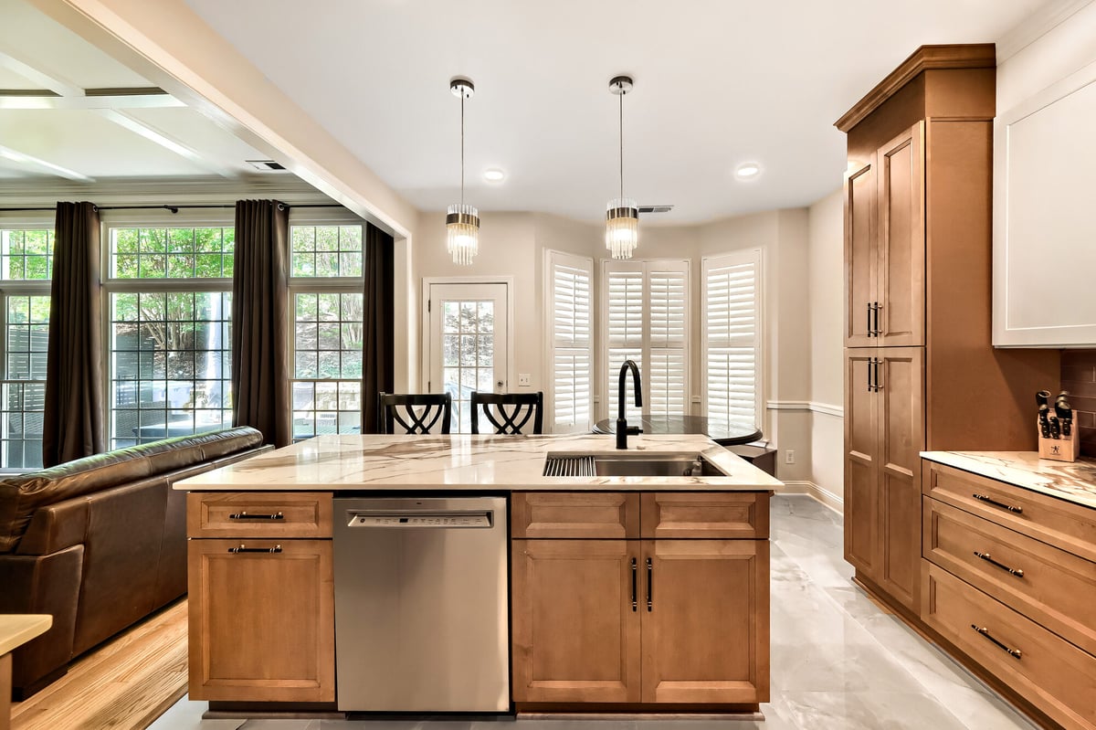 kitchen-island-two-tone-cabinets-open-to-living-room-pendant-lights-atlanta-ga-optimized