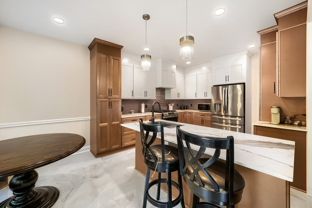 kitchen-two-tone-cabinets-waterfall-island-bar-stools-atlanta-ga-optimized