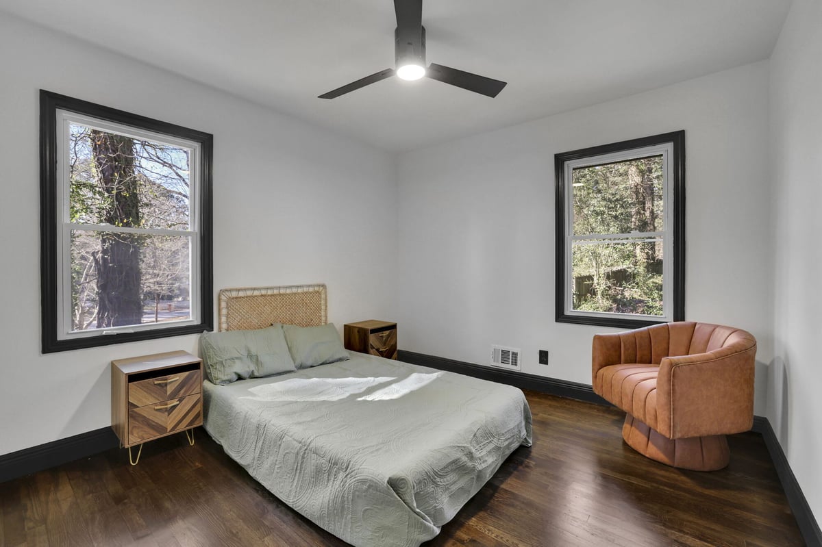 bedroom-bed-leather-chair-ceiling-fan-atlanta-ga-optimized