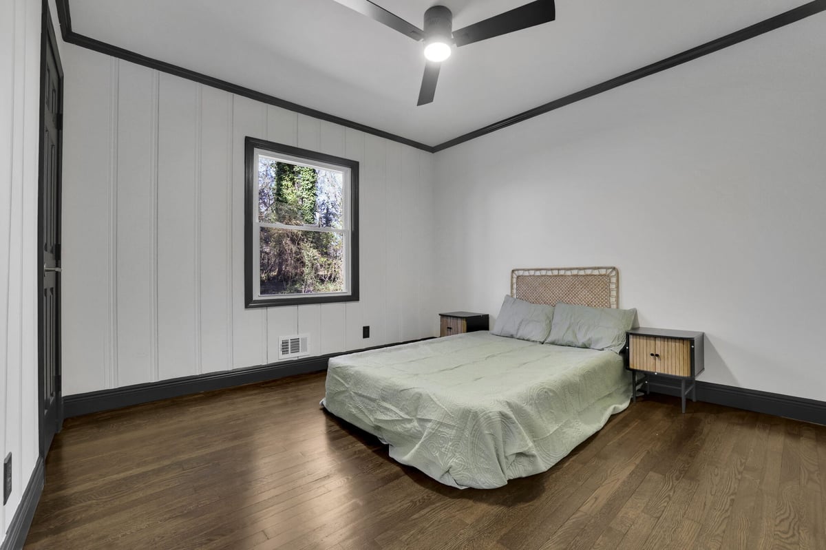 bedroom-bed-nightstand-wood-paneled-wall-atlanta-ga-optimized