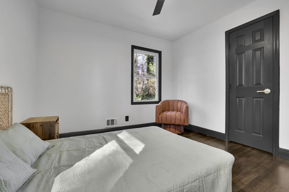 bedroom-bed-rattan-chair-dark-door-atlanta-ga-optimized