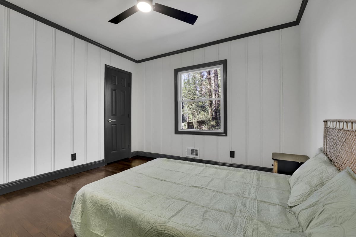 bedroom-bed-wood-paneling-black-door-atlanta-ga-optimized