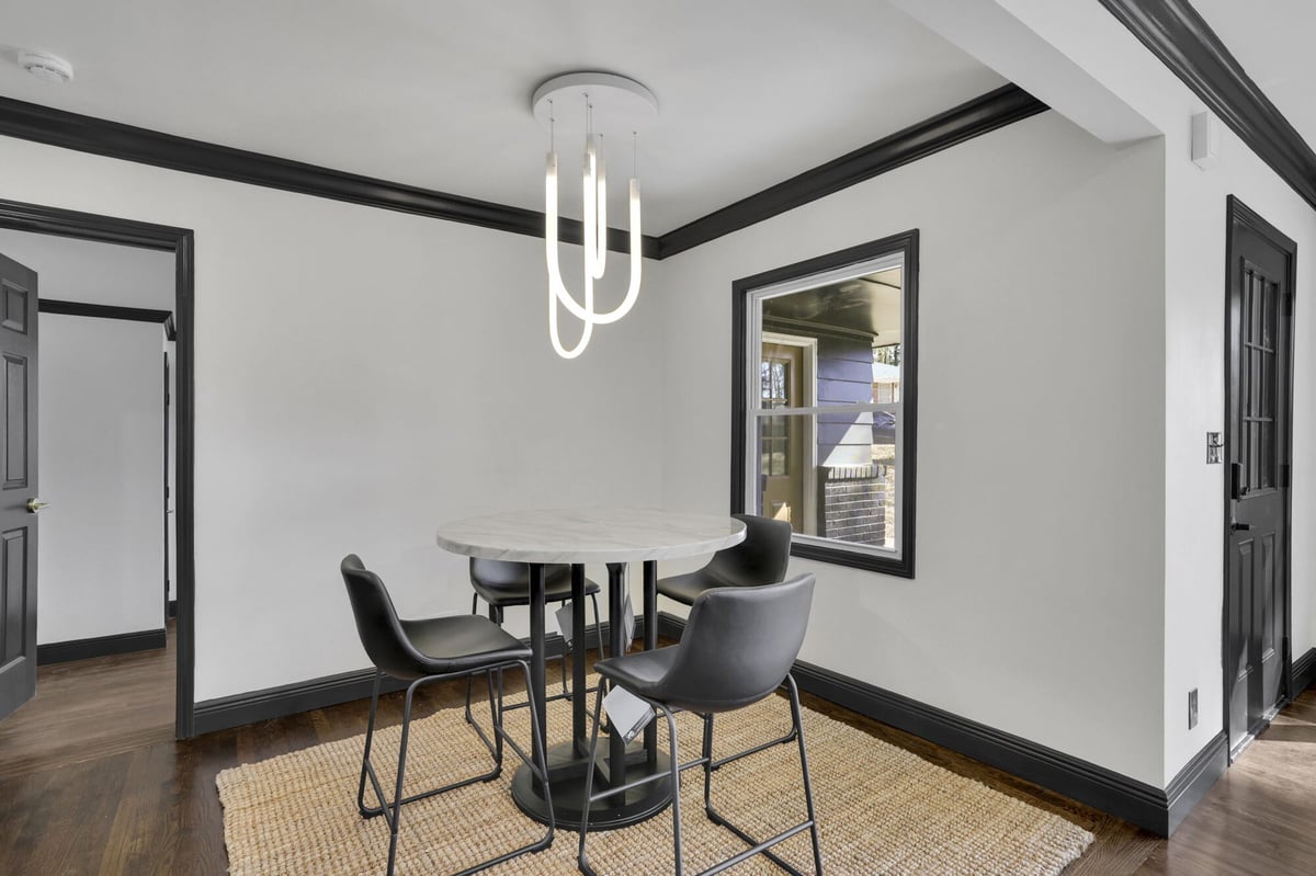 dining-nook-marble-table-black-chairs-pendant-chandelier-atlanta-ga-optimized