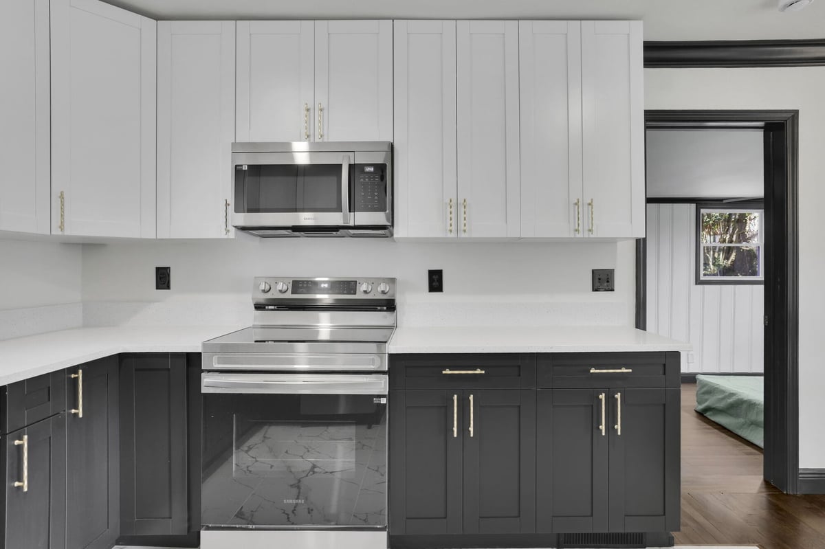 kitchen-stove-alcove-black-cabinets-stainless-range-atlanta-ga-optimized