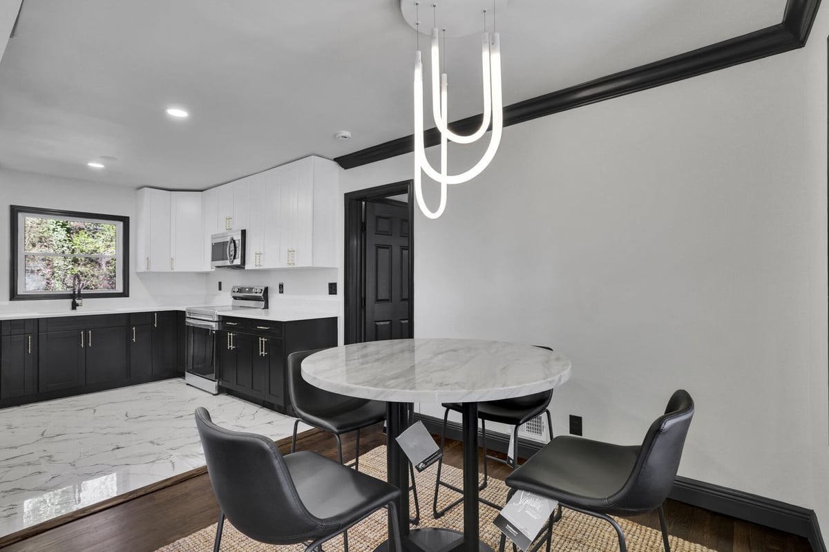 kitchen-white-cabinets-marble-dining-table-black-chairs-atlanta-ga-optimized