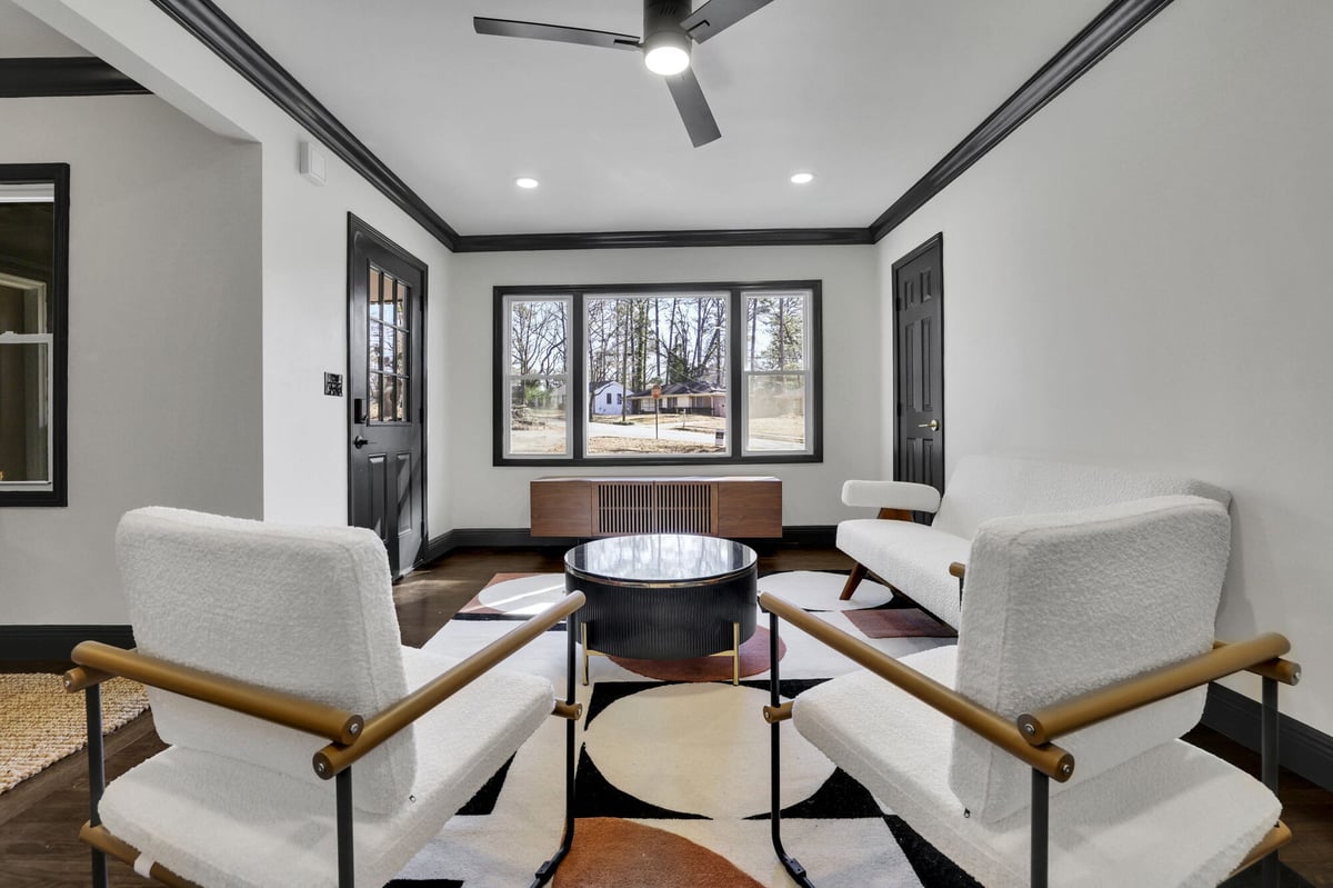 living-room-white-chairs-round-coffee-table-black-window-trim-atlanta-ga-optimized