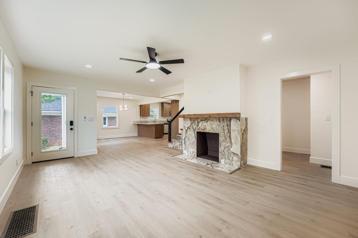 living-room-empty-stone-fireplace-open-floor-plan-atlanta-ga-optimized