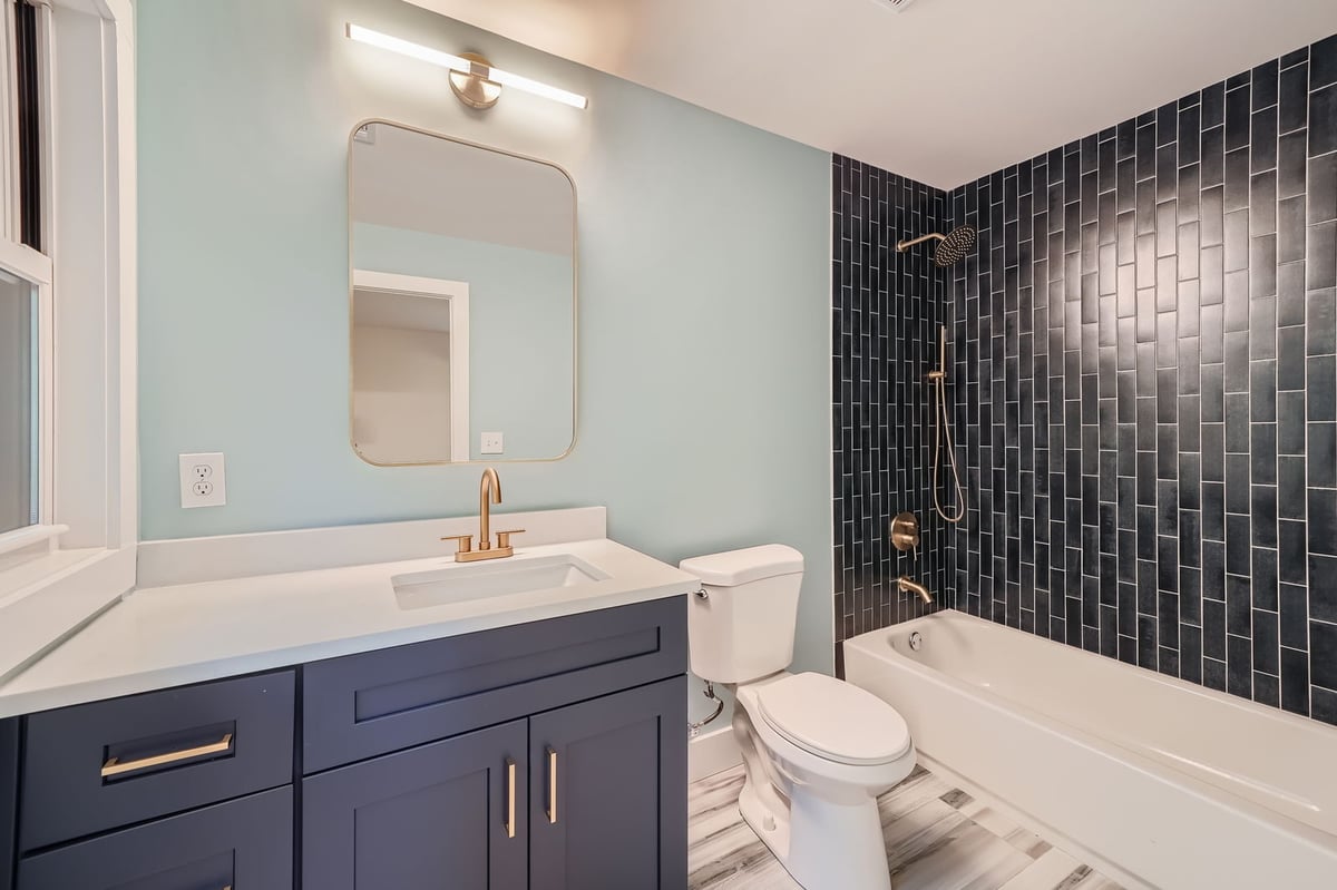 bathroom-vanity-black-tile-tub-shower-gold-fixtures-atlanta-ga-optimized