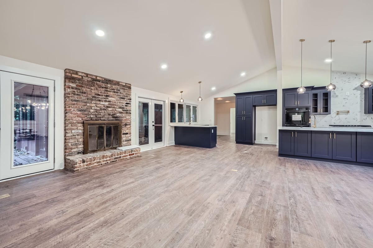 living-room-stone-fireplace-vaulted-ceiling-skylights-atlanta-ga-optimized
