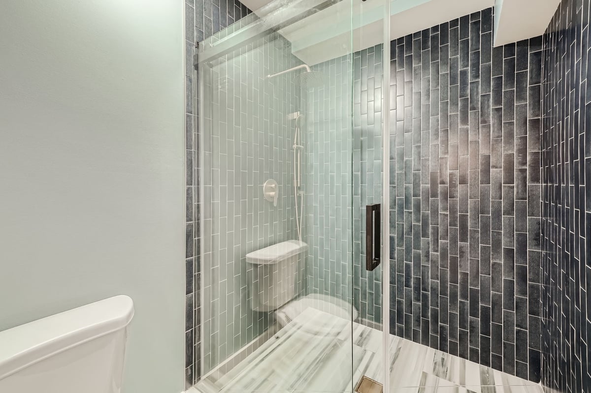 lower-level-bathroom-glass-shower-gray-tile-atlanta-ga-optimized