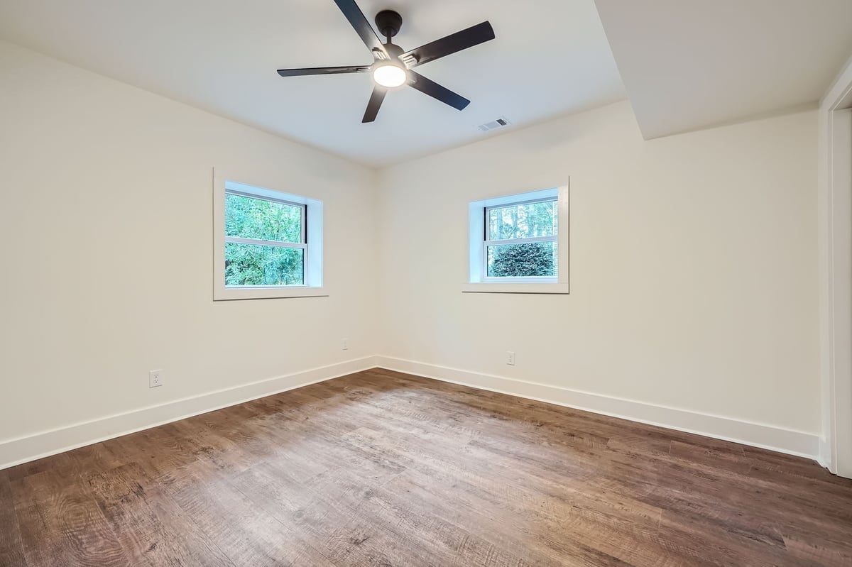 lower-level-bedroom-empty-windows-ceiling-fan-atlanta-ga-optimized