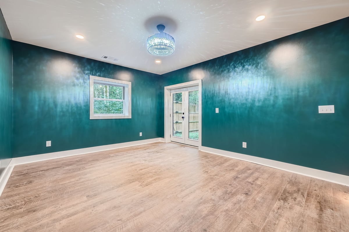 lower-level-family-room-teal-accent-wall-windows-atlanta-ga-optimized