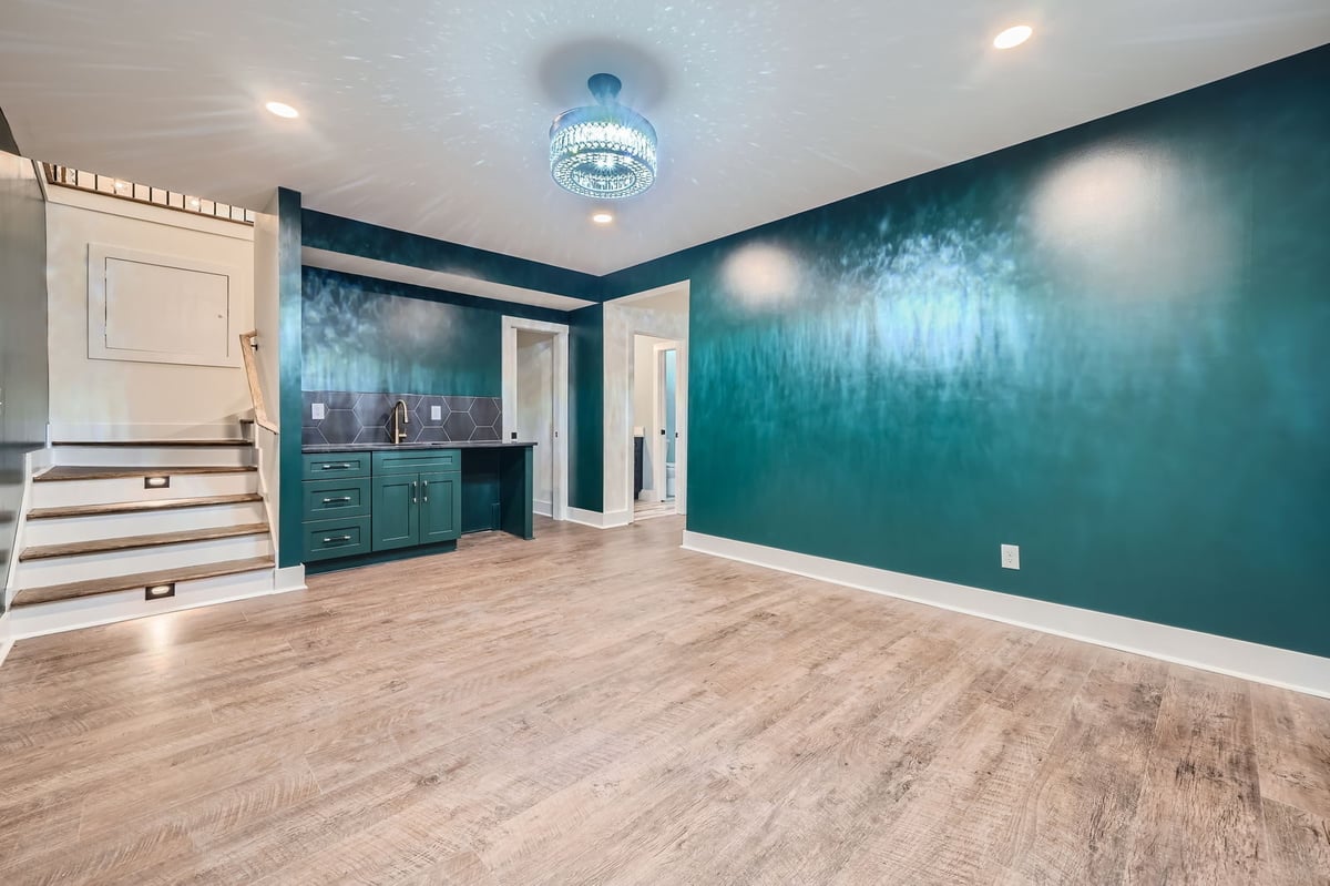 lower-level-family-room-teal-walls-staircase-bar-atlanta-ga-optimized