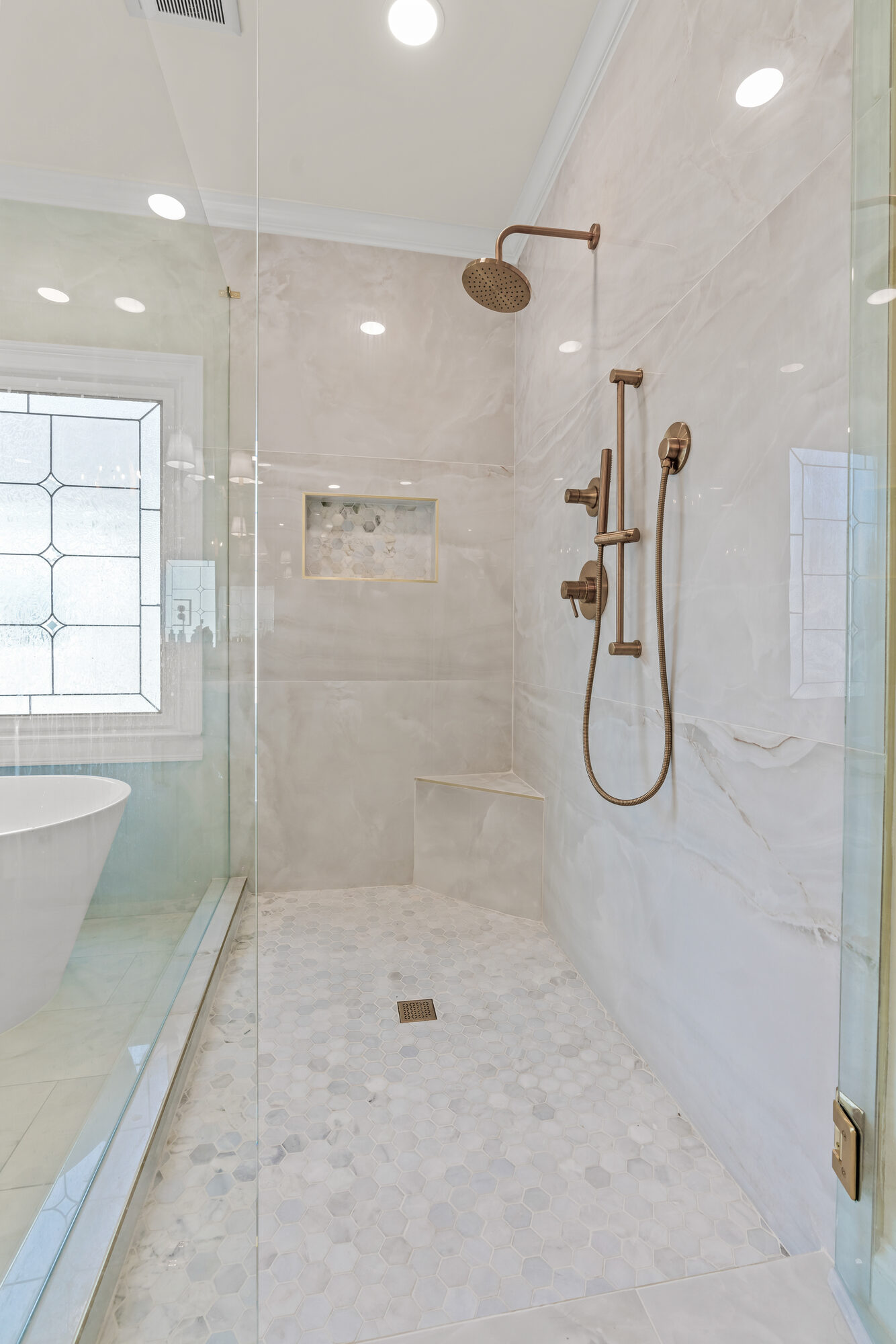 glass-shower-gold-fixtures-tile-closeup-atlanta-ga-optimized