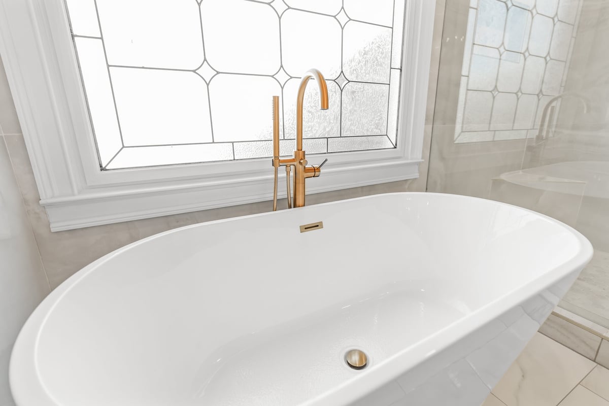 freestanding-tub-gold-floor-mount-faucet-closeup-atlanta-ga-optimized