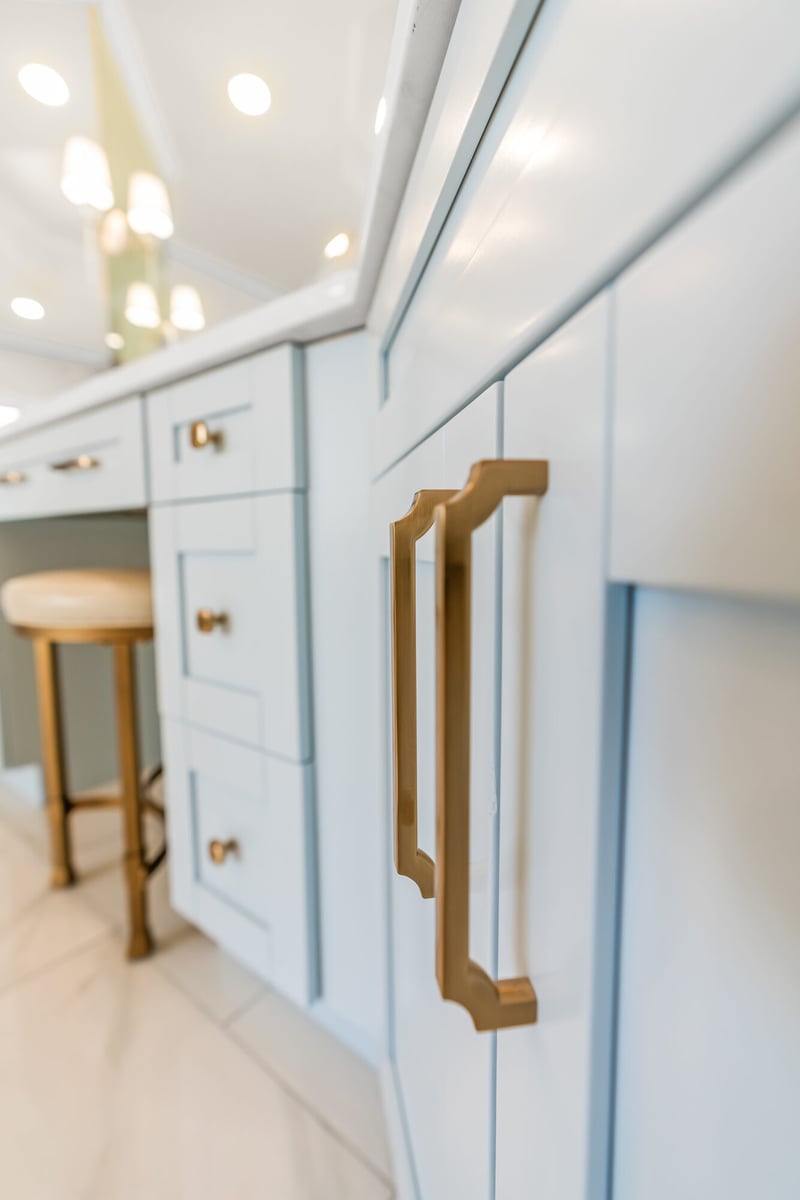 vanity-cabinetry-blue-cabinets-gold-pulls-stool-atlanta-ga-optimized