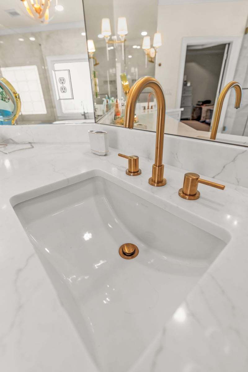 vanity-sink-marble-counter-gold-faucet-closeup-atlanta-ga-optimized