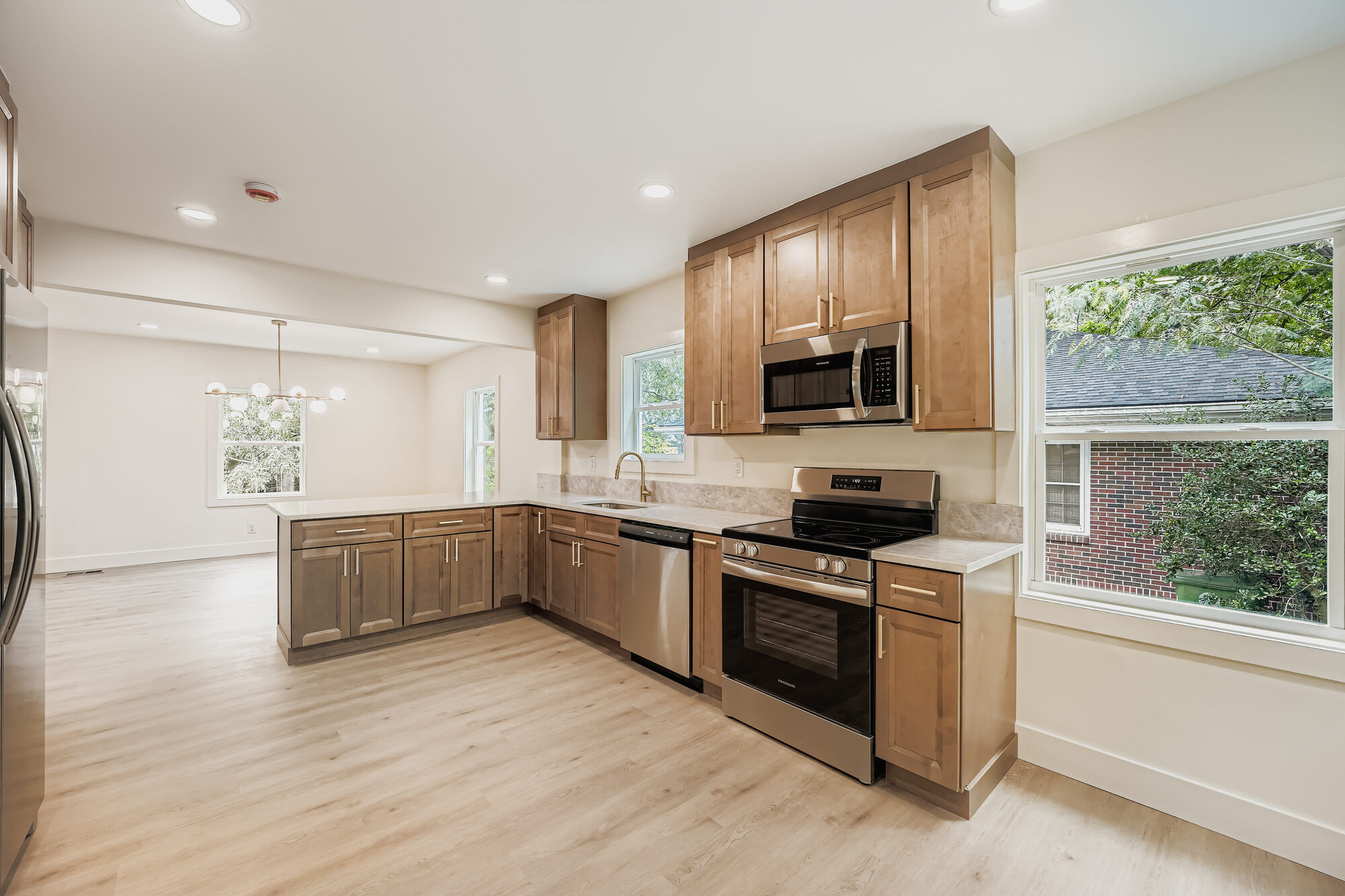 kitchen-empty-wood-cabinets-stainless-range-atlanta-ga-optimized
