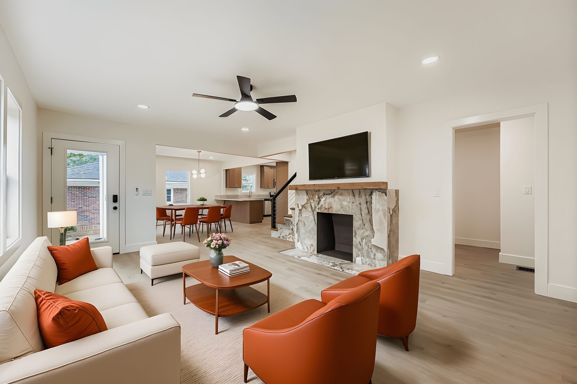 living-room-orange-chairs-stone-fireplace-tv-atlanta-ga-optimized